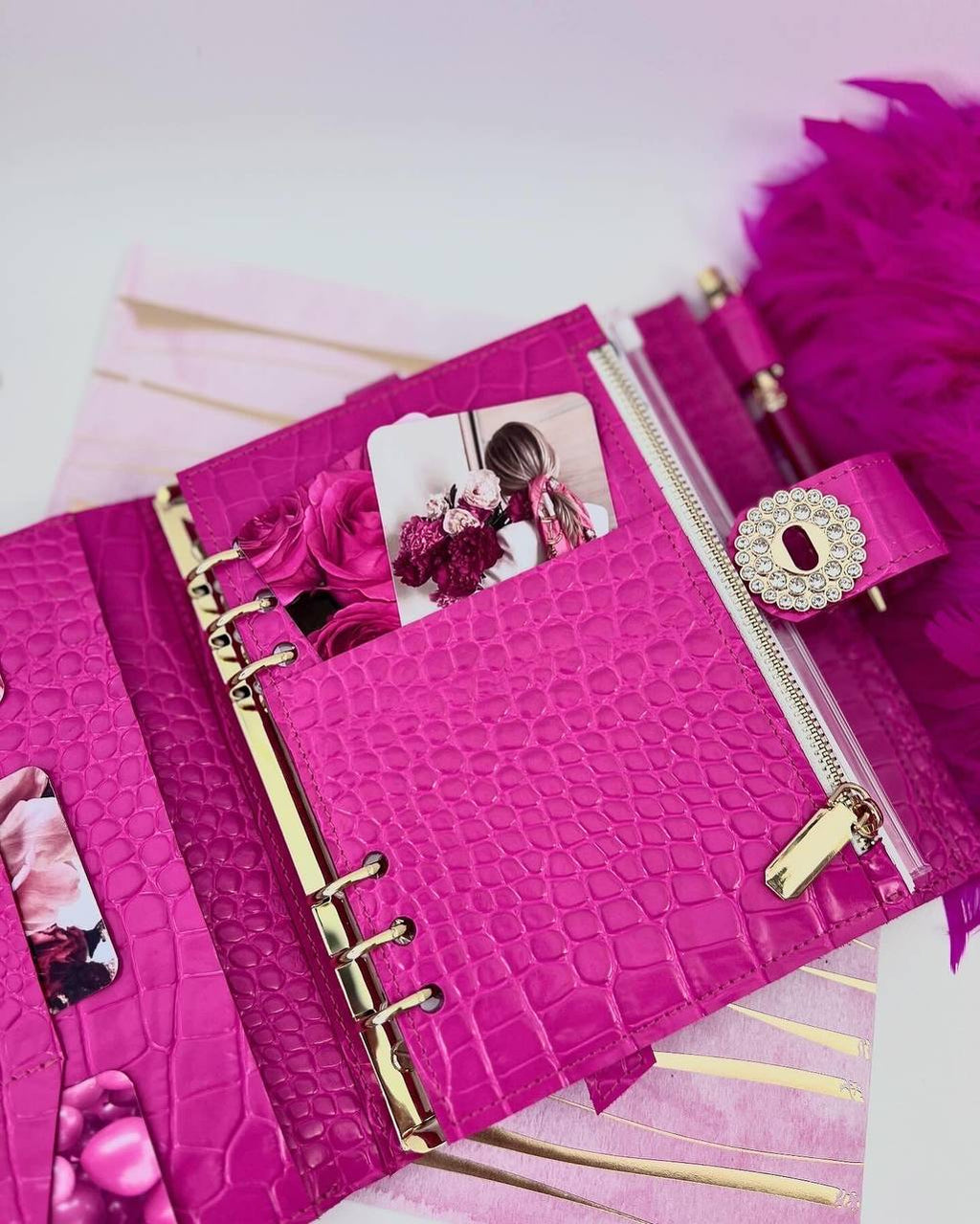 Cyprus, Limassol. Hot pink leather notebook cover A5 with big gold binder. Cover for A4 and A5 documents format.