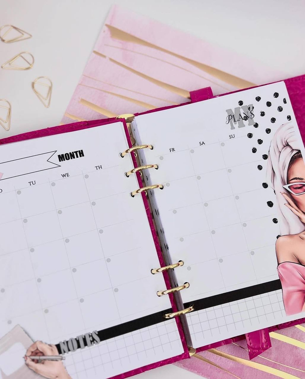 Cyprus, Limassol. Hot pink leather notebook cover A5 with big gold binder. Cover for A4 and A5 documents format.