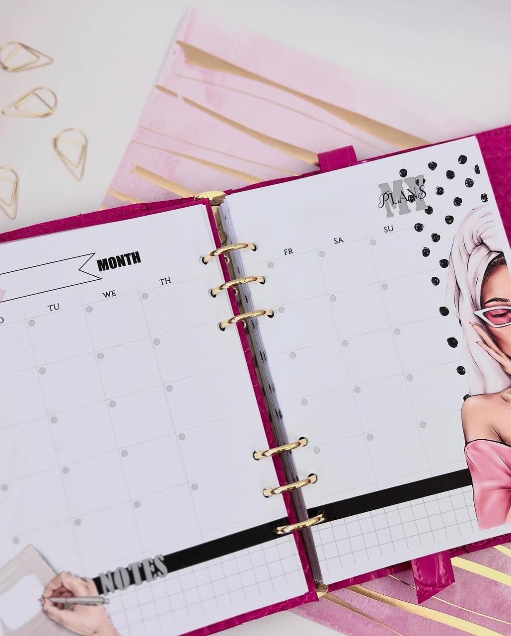 Cyprus, Limassol. Hot pink leather notebook cover A5 with big gold binder. Cover for A4 and A5 documents format.